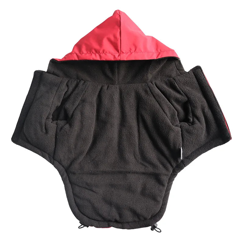 Black fleece hooded dog coat with red lining on a white background