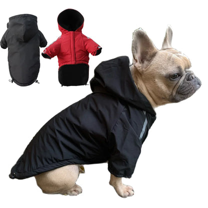 Dog wearing a black hooded coat with additional coats in black and red shown on a white background.
