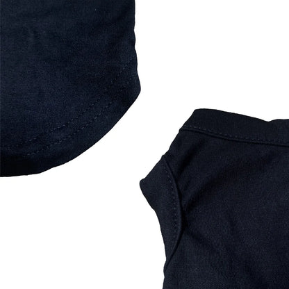 Close-up of a black shirt collar and sleeve on a white background