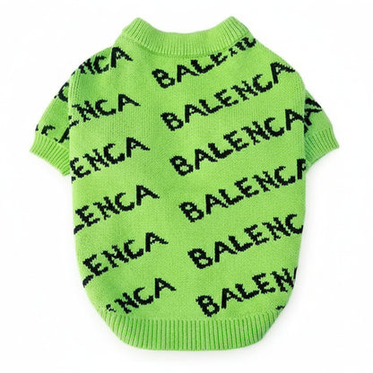 Green sweater with 'BALENCIAGA' branding on a white background