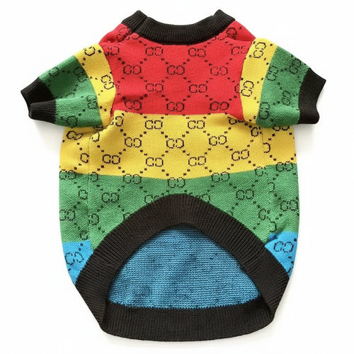 Colorful dog sweater with a pattern on a wooden surface