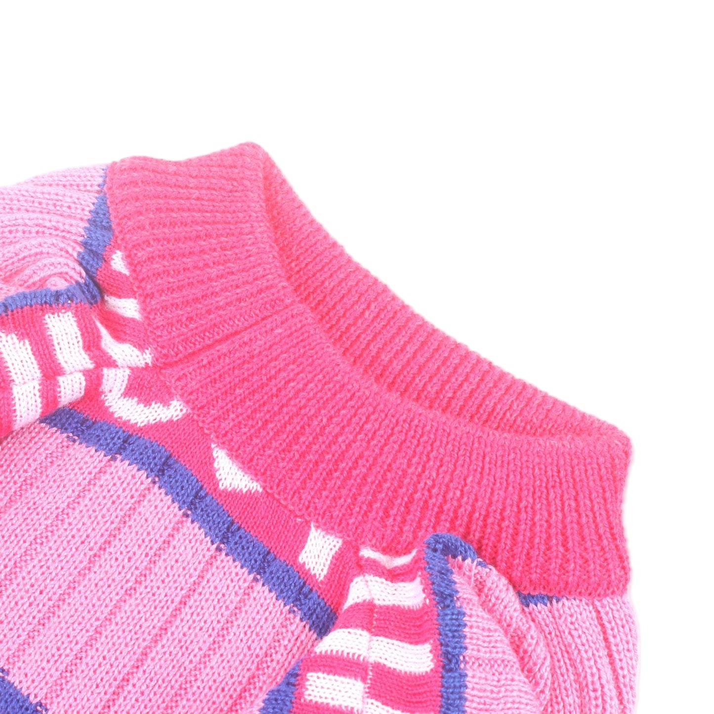 Close-up of pink sweater with white and blue patterns on a white background