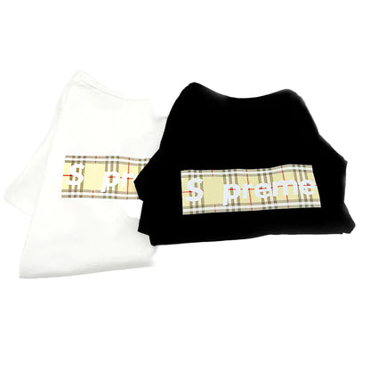 Black sweatshirt with plaid design and text on a white background