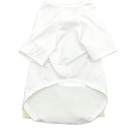White baby outfit with a green and brown bag on a white background
